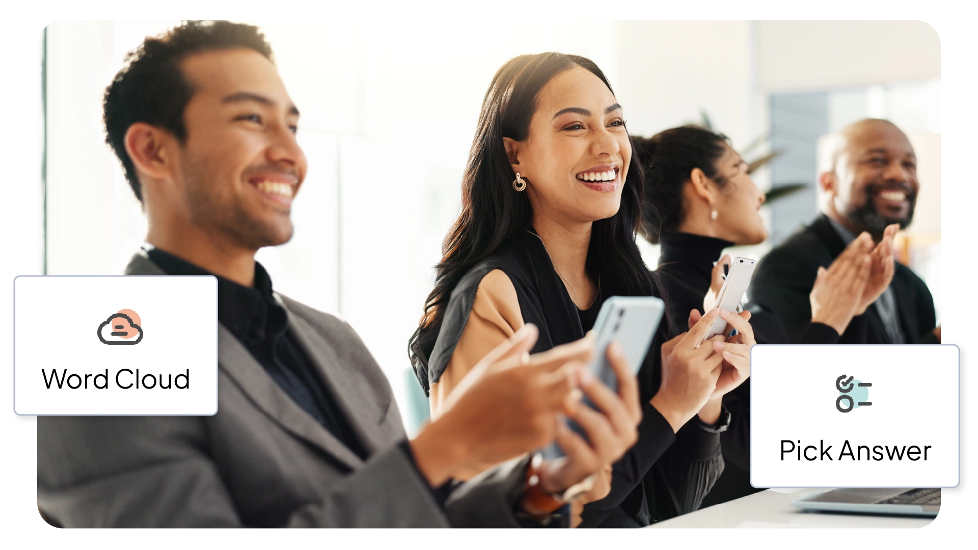 People in a meeting smiling and using their phones during a presentation.