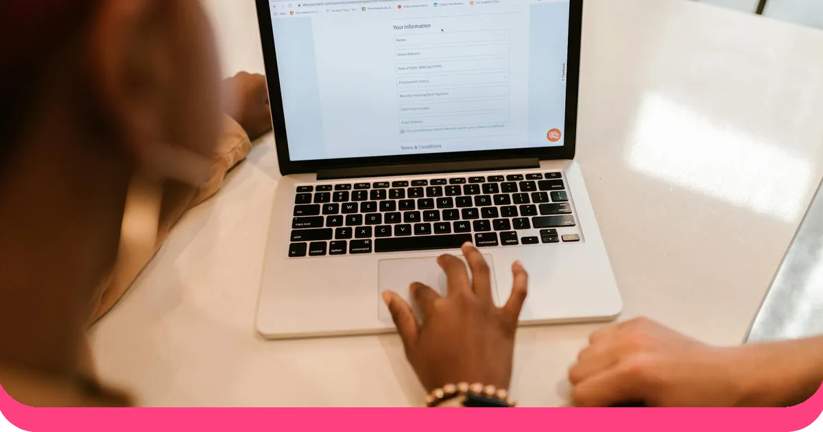 Person filling out an anonymous online survey form on a laptop with AhaSlides branding