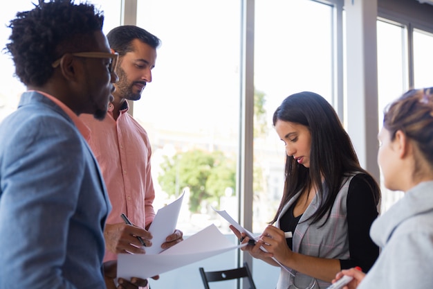Colleagues discussing in a meeting room