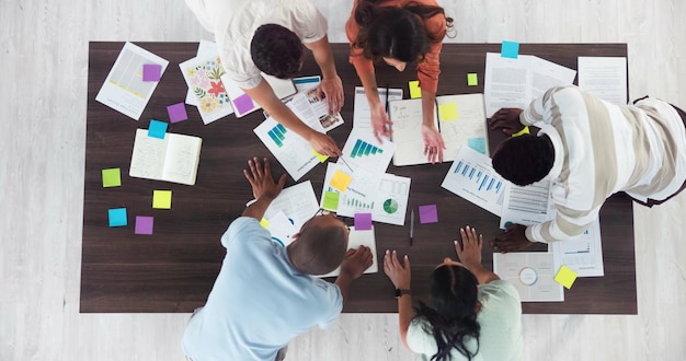 Team collaborating on documents in a meeting
