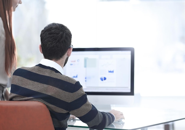 Person analyzing data on screen
