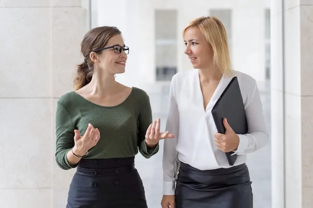 Cheerful female professionals engaging in a dynamic discussion, showing how presenters connect with their audience