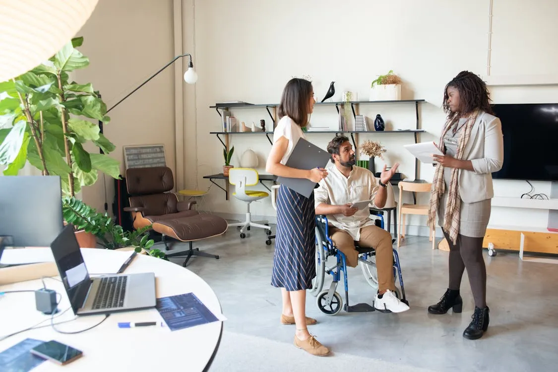 Diverse team having an open discussion in a modern inclusive office environment