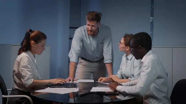 Manager leading team discussion in office
