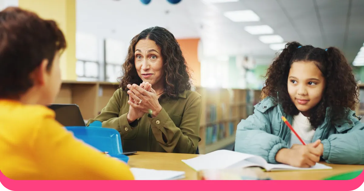 Teacher asking an engaging question to students in classroom