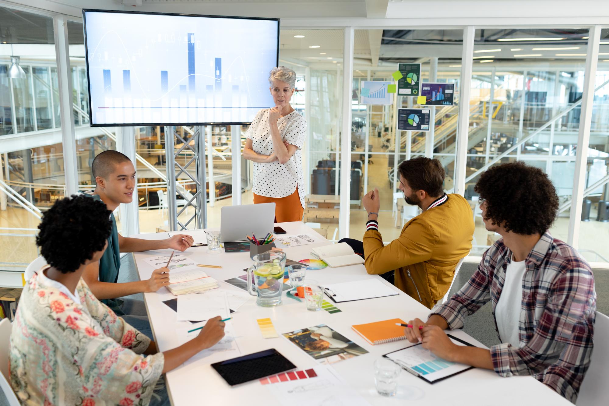 Professional presenting AI-generated slides to an engaged audience in a conference room